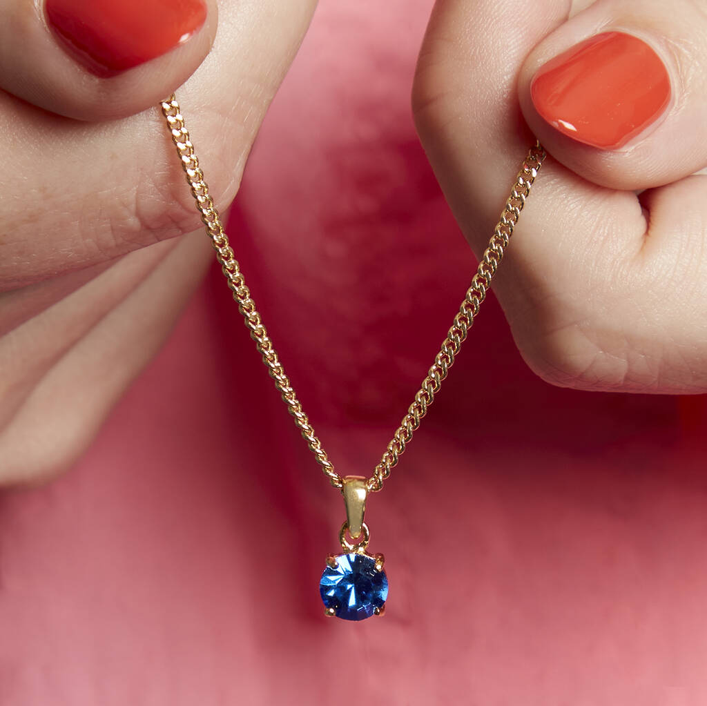 Lab-grown Oval Blue Sapphire Pendant with Diamond Accents